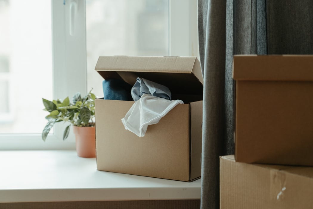 Brown Cardboard Box With White Paper